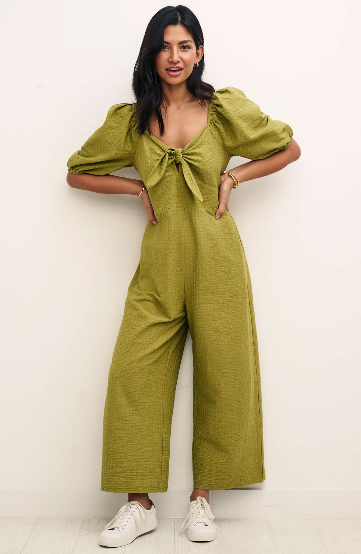 This green seersucker sustainable jumpsuit from Nobody's Child is made with organic cotton and EcoVero viscose.