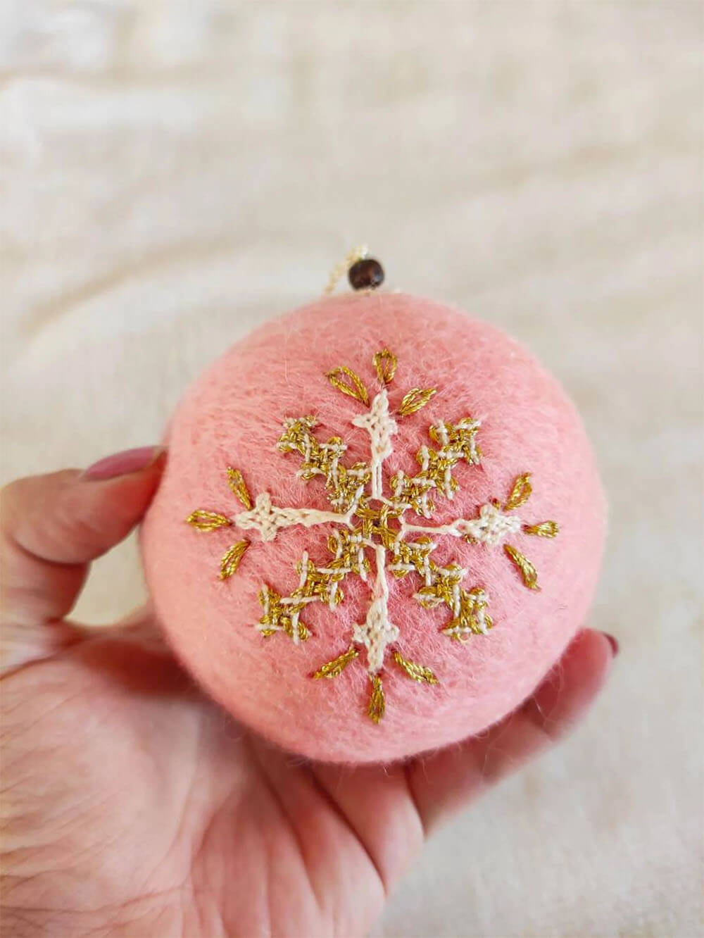 pink and gold felted wool ornament