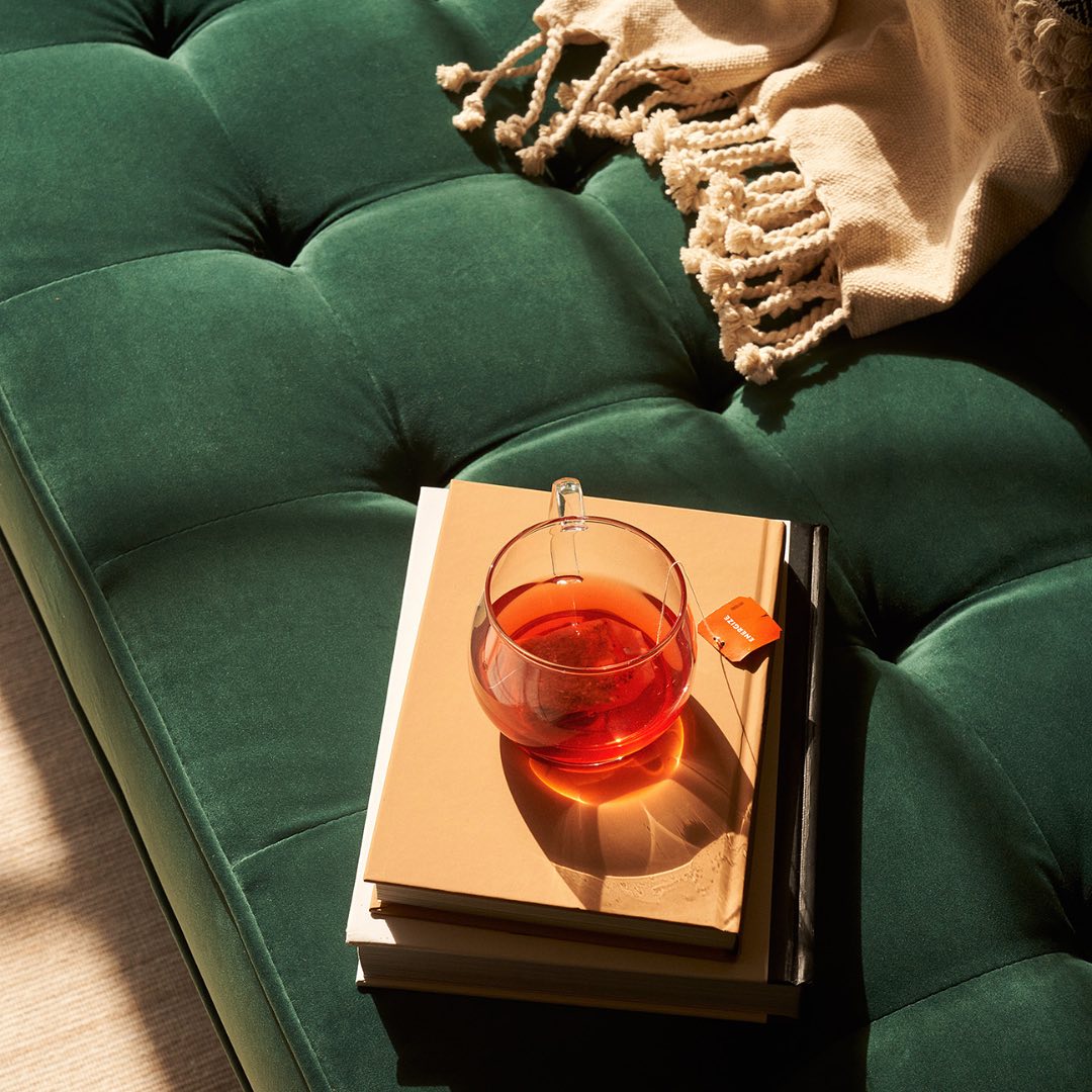emerald green velvet couch by fernish - companies making it easy to reduce waste