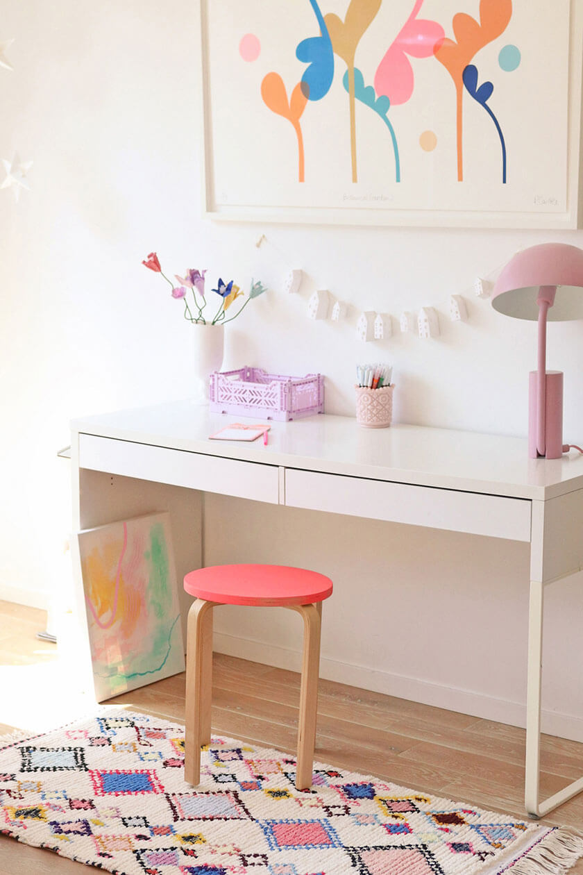 cute pastel workspace with white design and colorful rug
