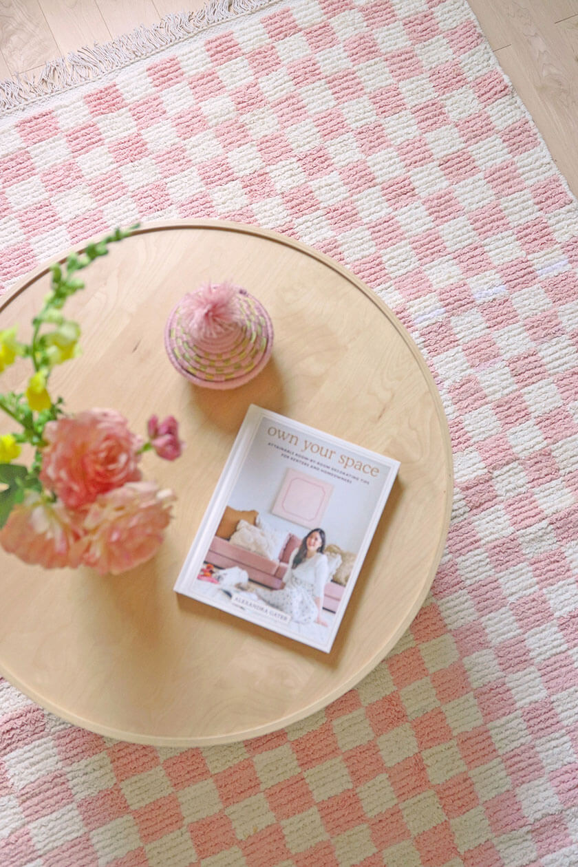 pink checkerboard rug with cute coffee table