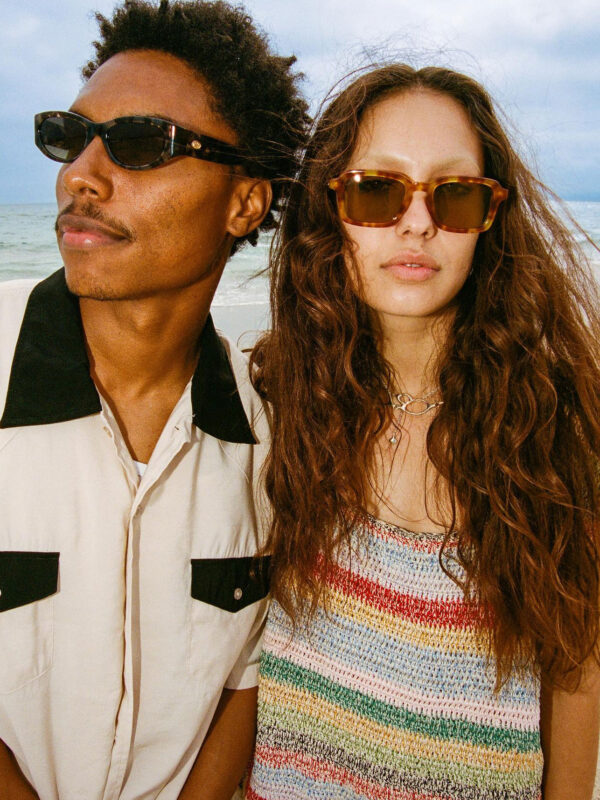 man and woman wearing crap eyewear eco friendly sunglasses on the beach in LA - sustainable directory on eco club