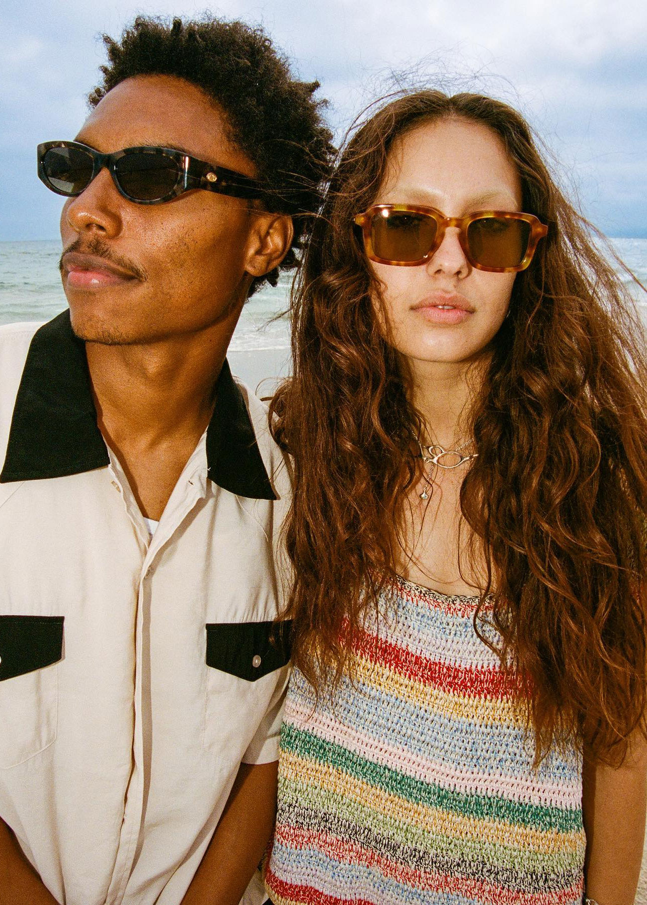 man and woman wearing crap eyewear eco friendly sunglasses on the beach in LA - sustainable directory on eco club