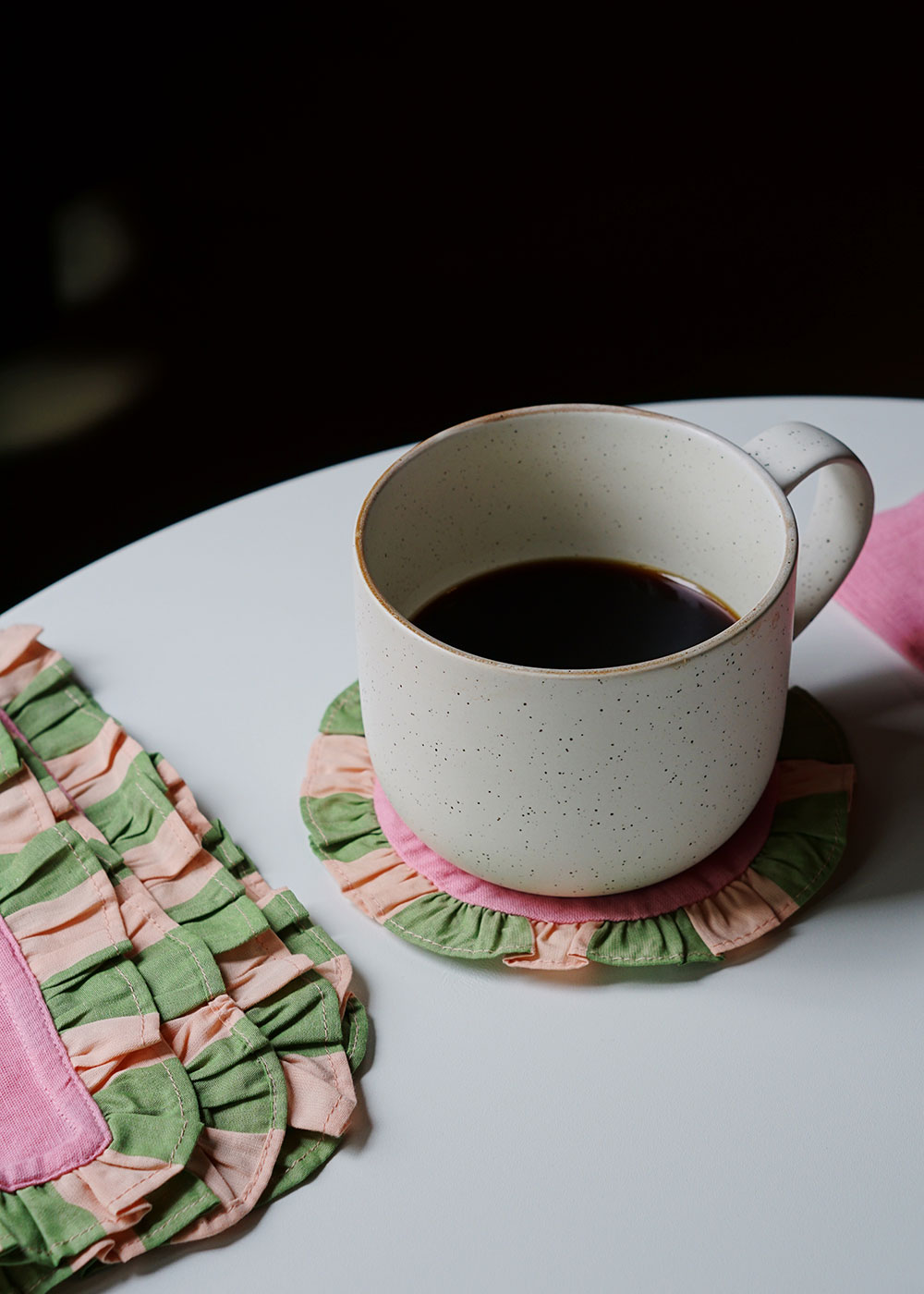 set of pink + green striped coasters and ruffle napkins from wallflower shop