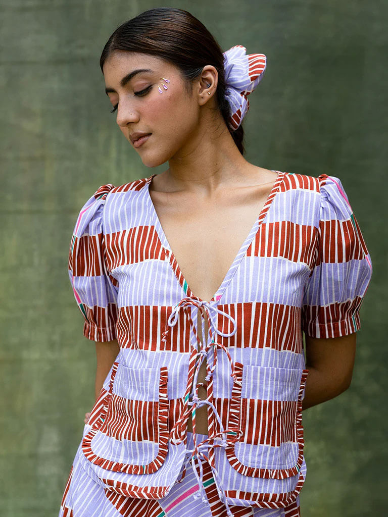 Short stripe top with patch pockets and frill detail. Front tie closure. - by ethical brand Short stripe top with patch pockets and frill detail. Front tie closure - by ethical brand ikkivi