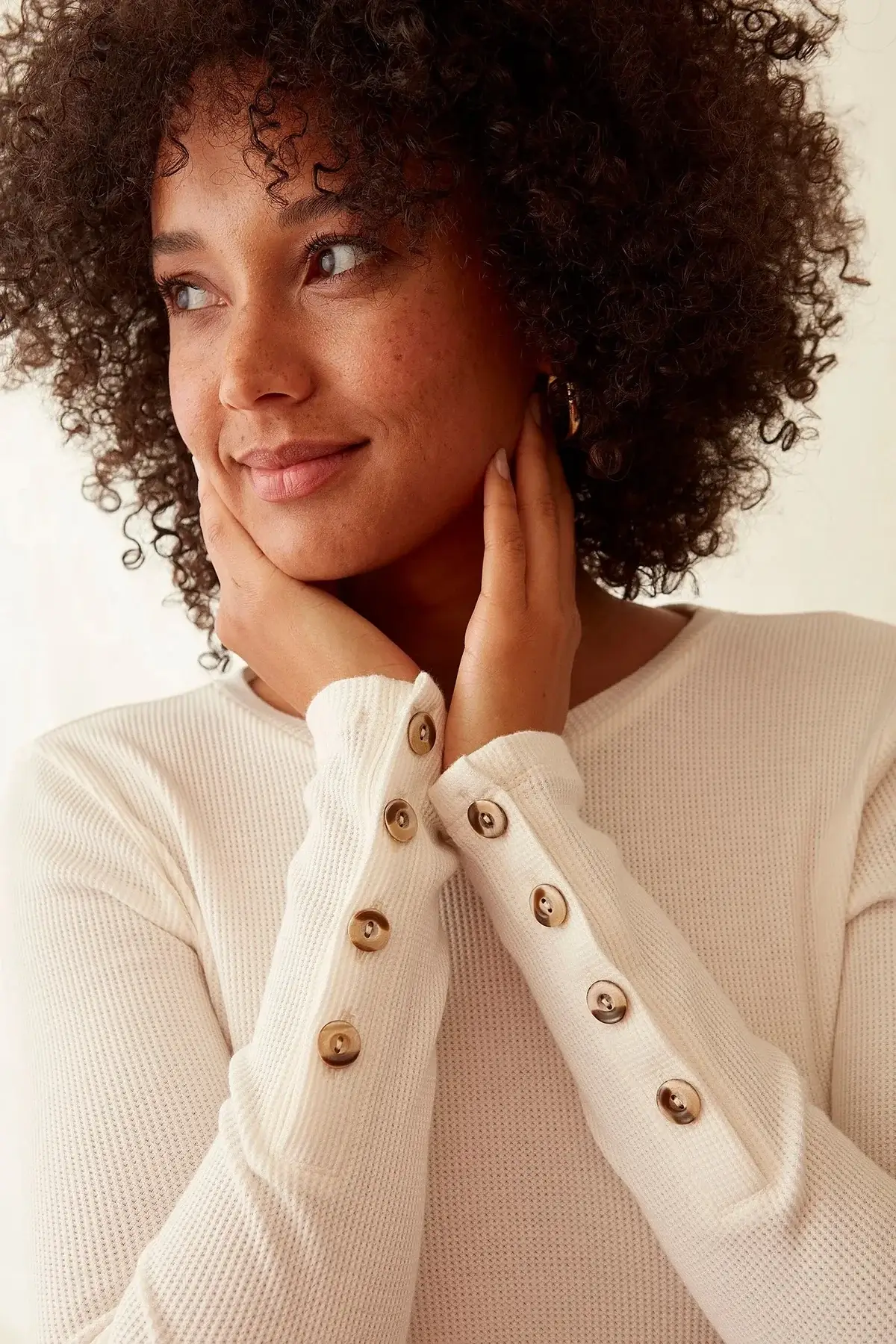 woman wearing button sleeve shirt from sustainable fashion brand grey state apparel