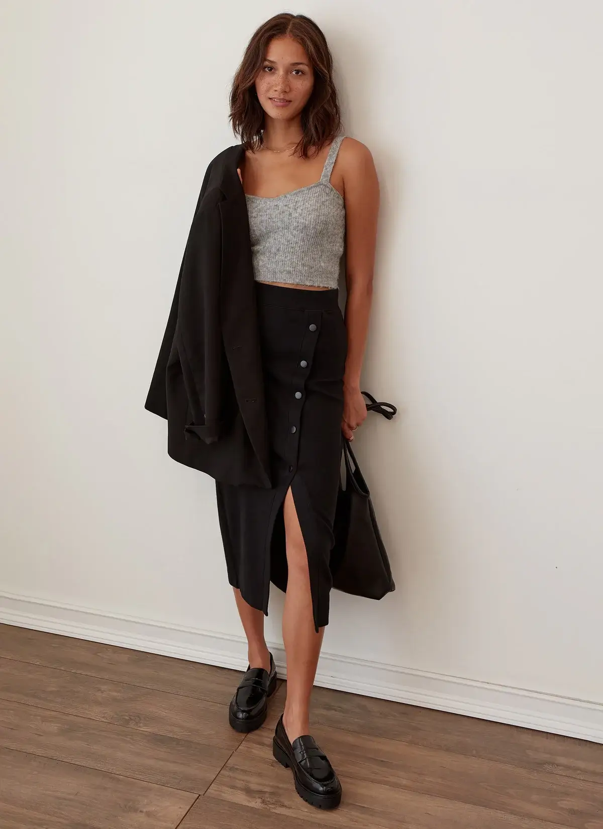 woman wearing skirt and top from sustainable fashion brand grey state apparel