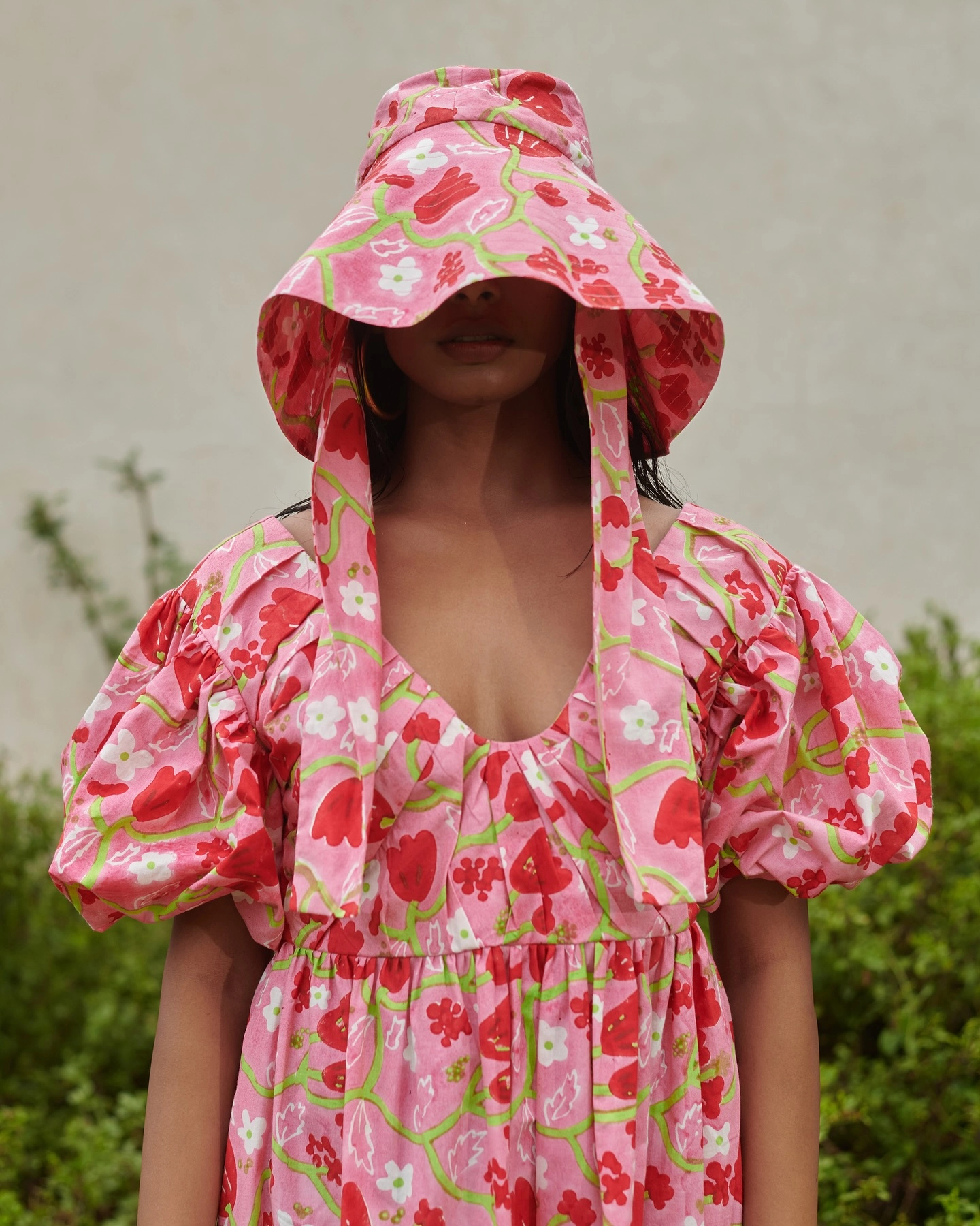 colorful bucket hat and ethically made dress by ikkivi