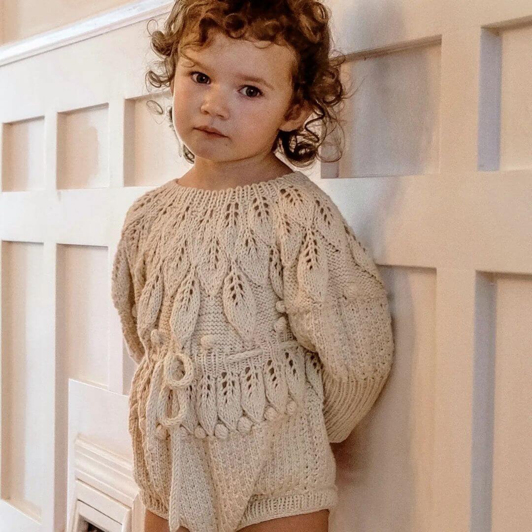 toddler wearing hand knited baby clothes by JuneBee Baby artisan clothing