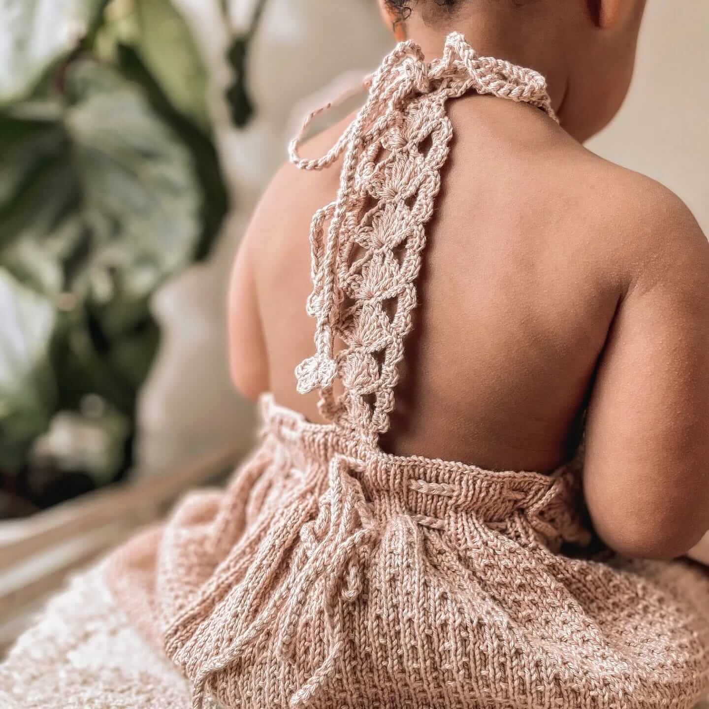 toddler wearing hand knited baby clothes by JuneBee Baby artisan clothing