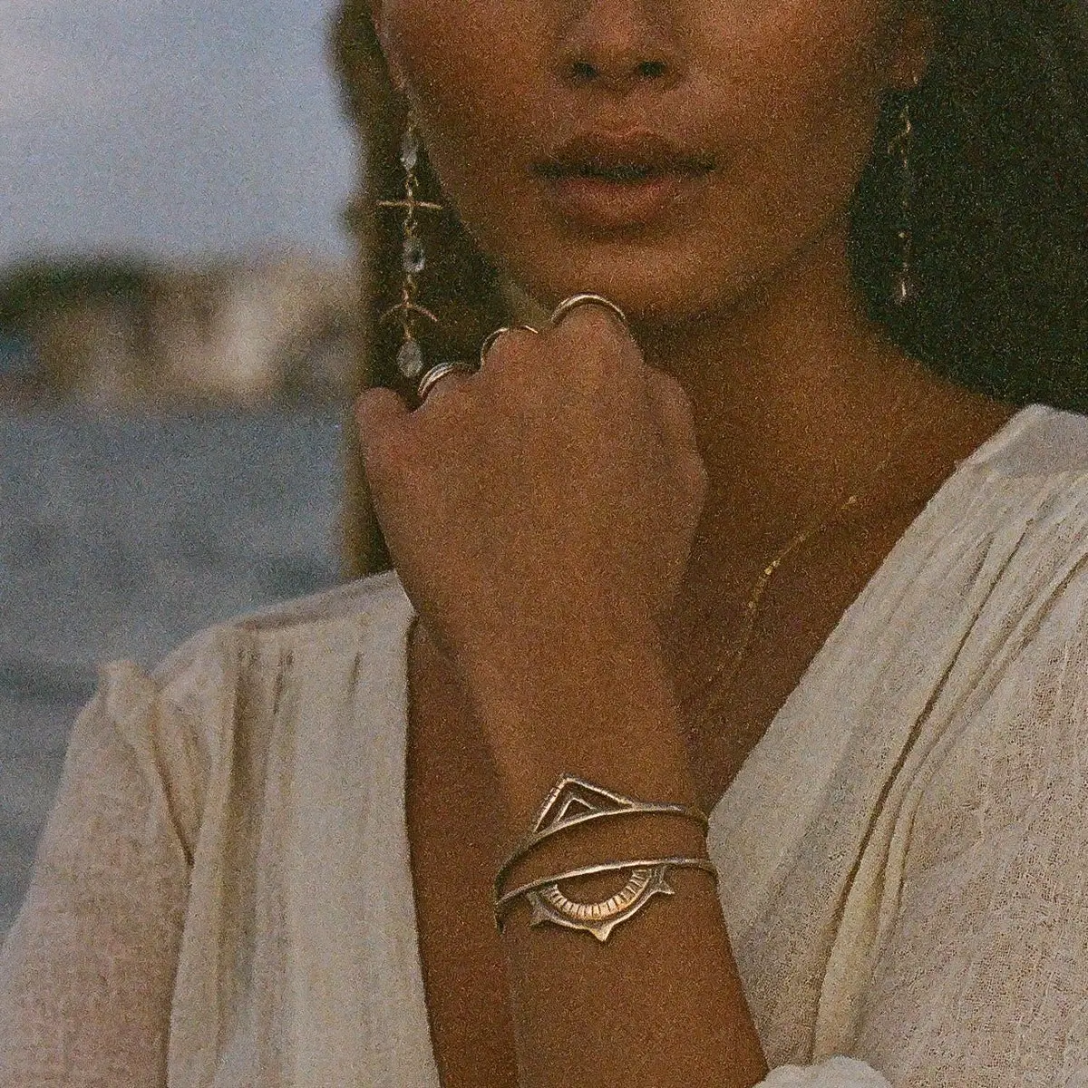 woman wearing gold bracelets by catori life bohemian jewelry