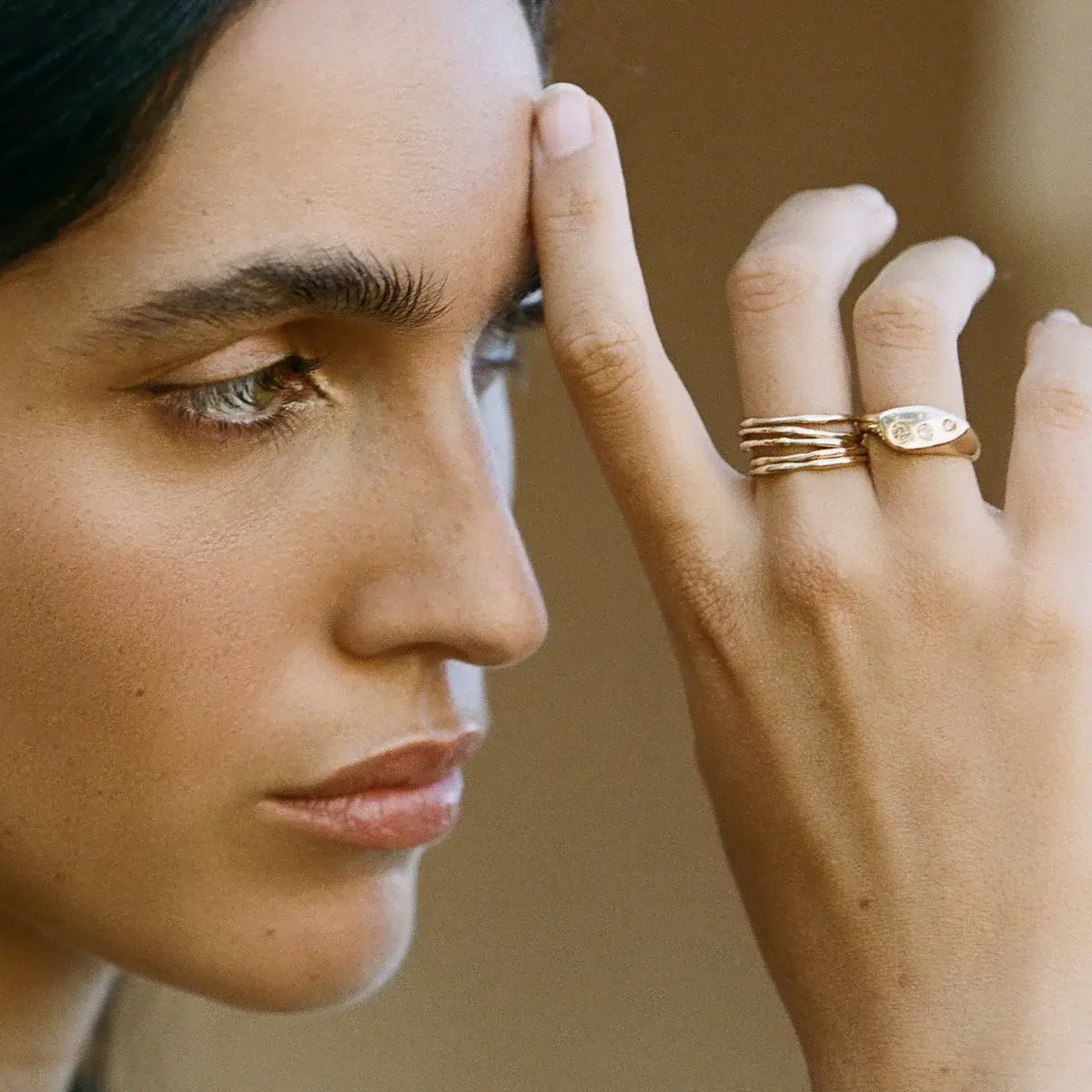 woman wearing recycled gold rings from catori life eco club member