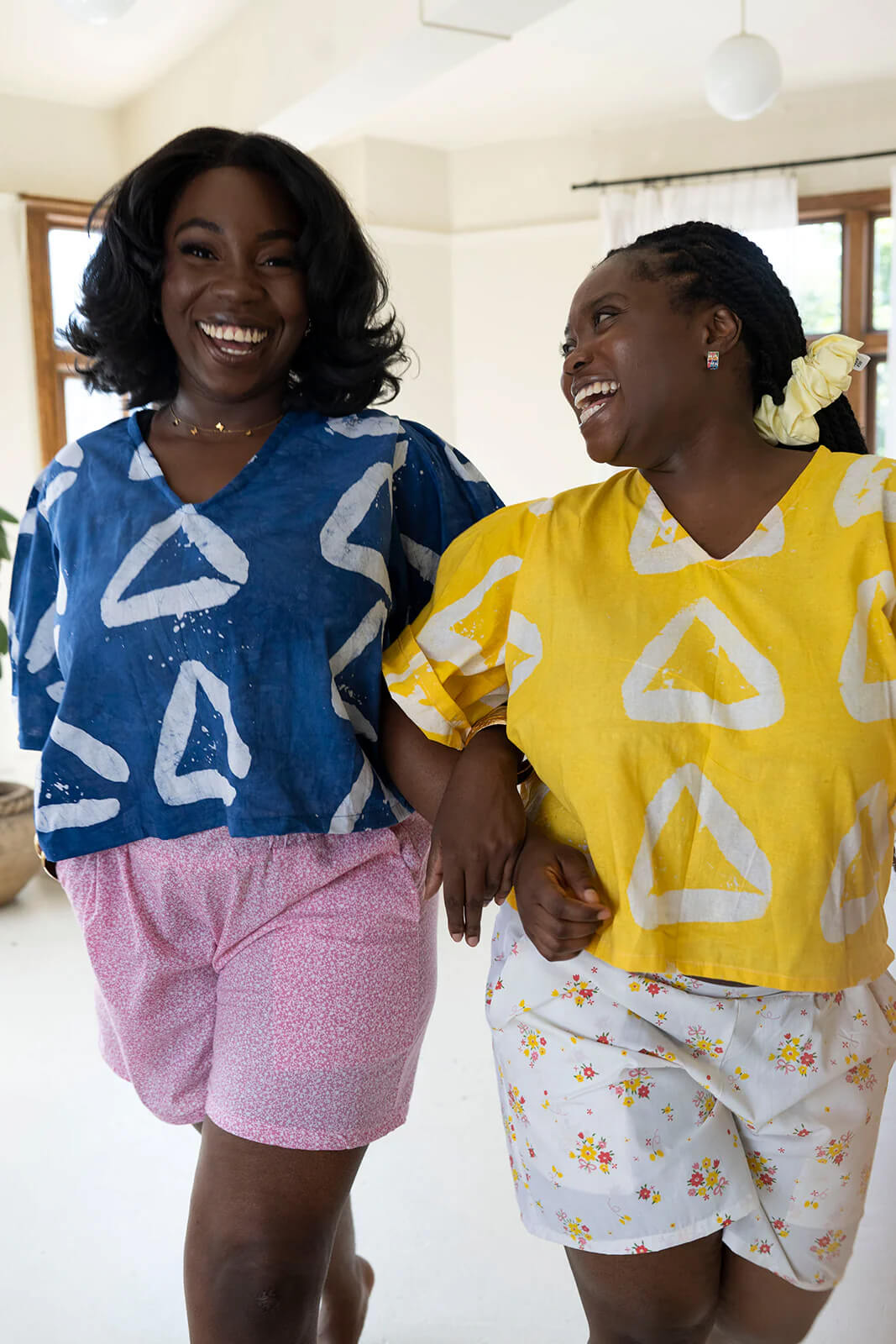 women wearing yellow and blue shirts by size inclusive slow fashion brand Oge Ajibe