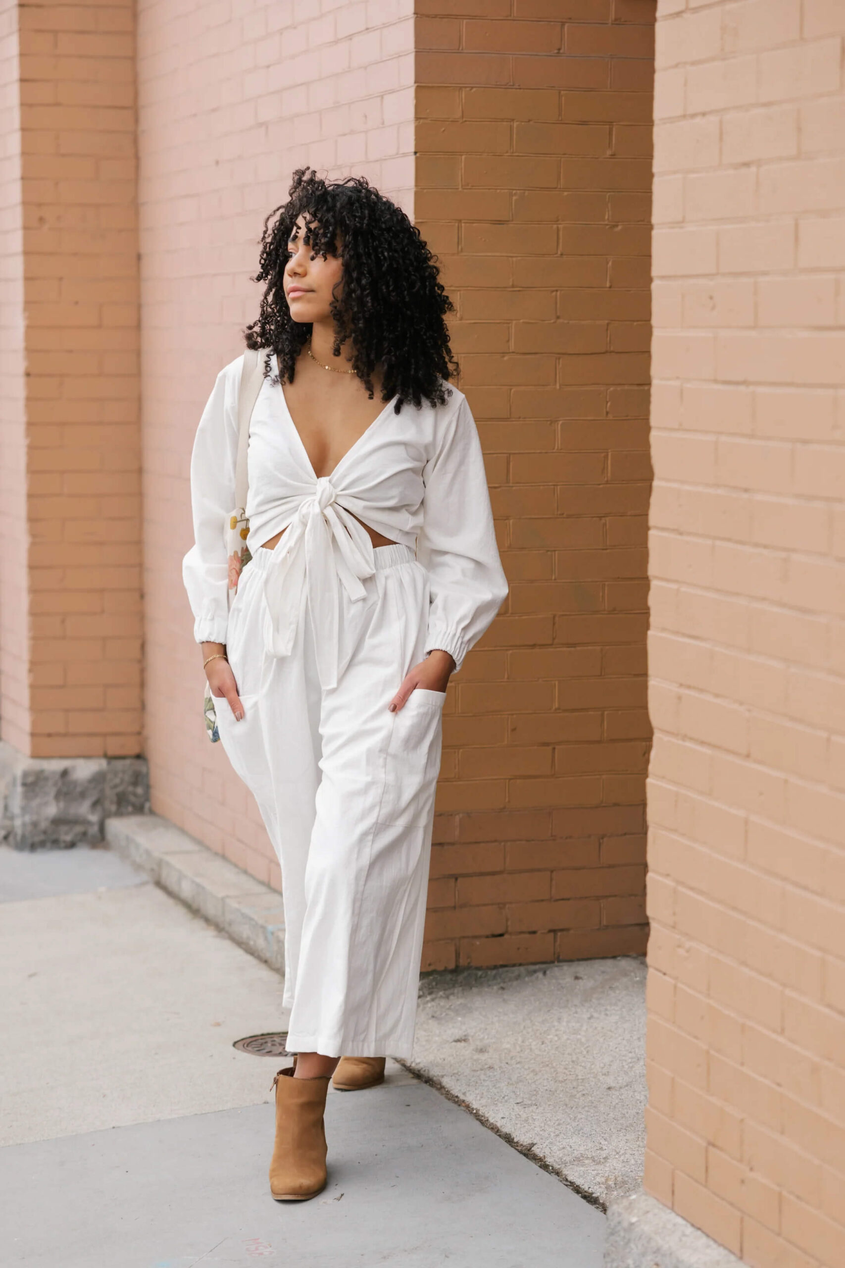 woman in white linen top and pant set by slow fashion brand Oge Ajibe