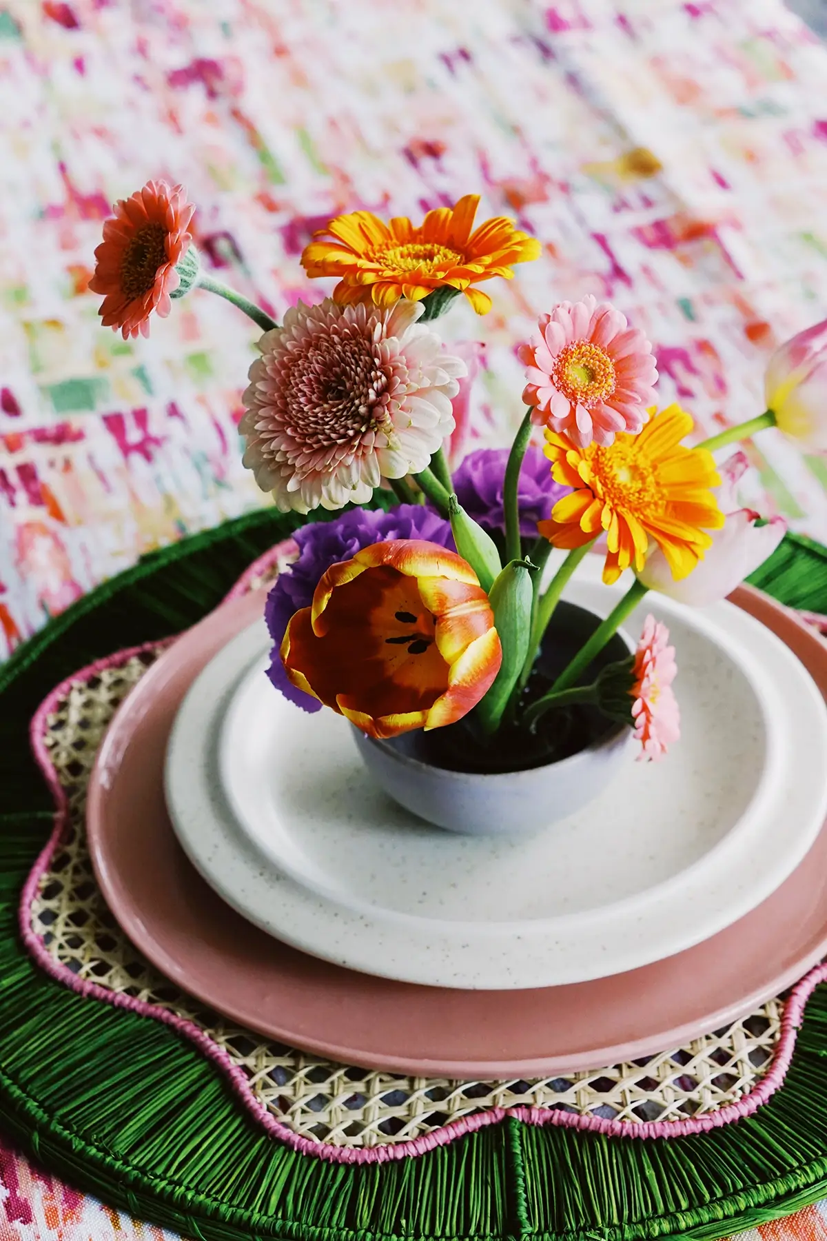 bouquet of flowers on woven placemats