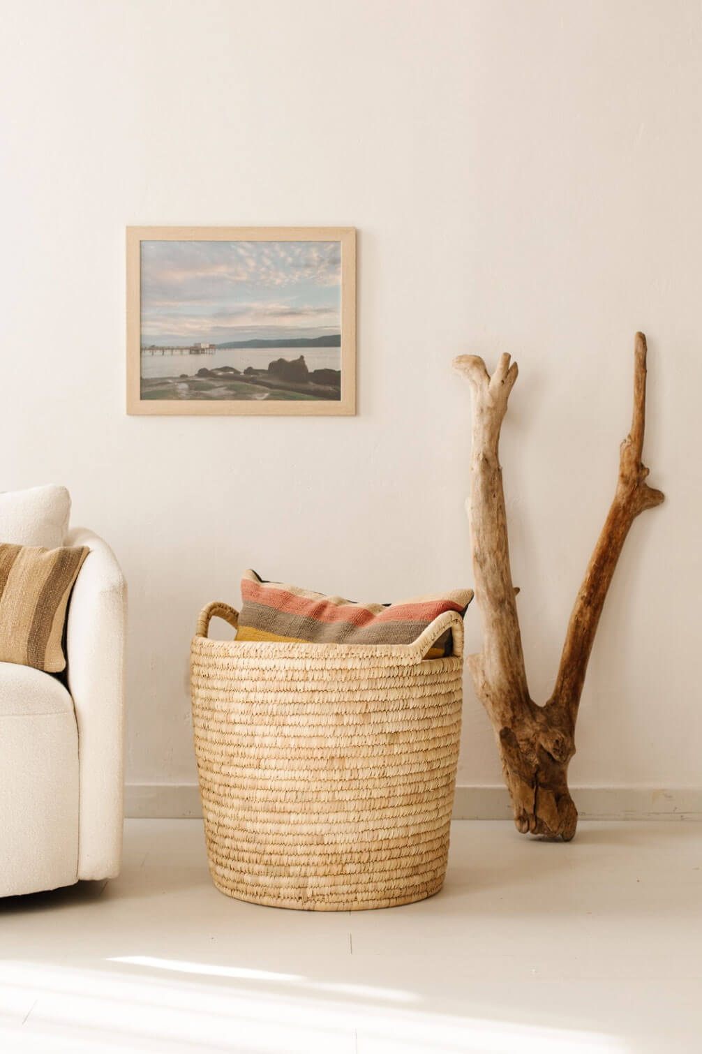 minimalist decor wall with fair trade basket and driftwood by will + atlas