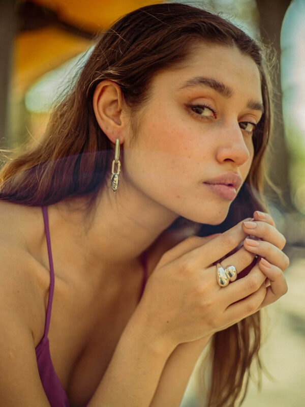 woman wearing sustainable & affordable fine jewelry by milk & rose