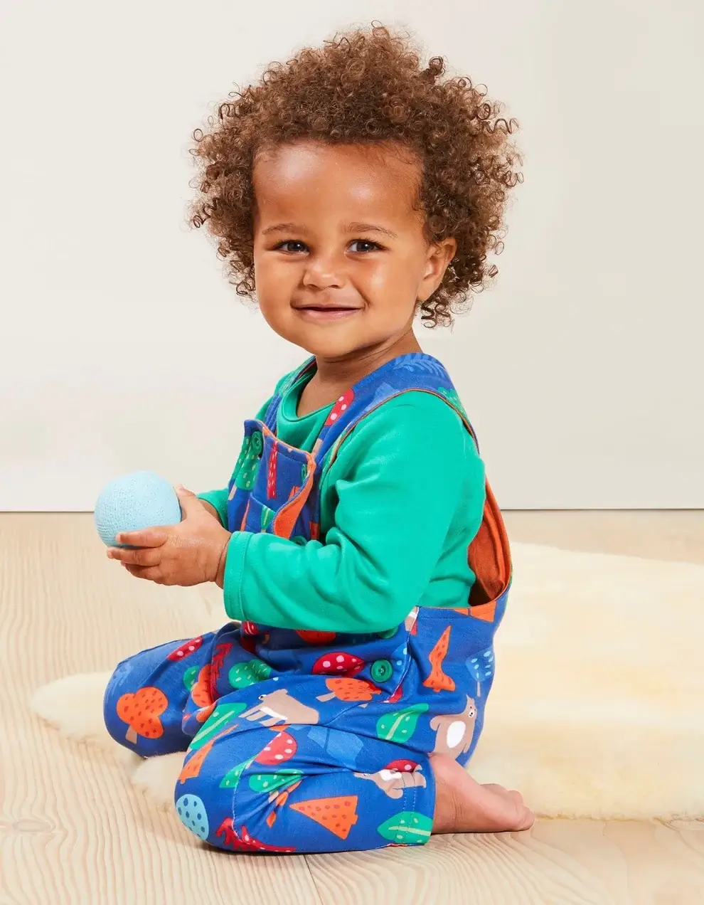boy wearing organic cotton baby clothes by toby tiger