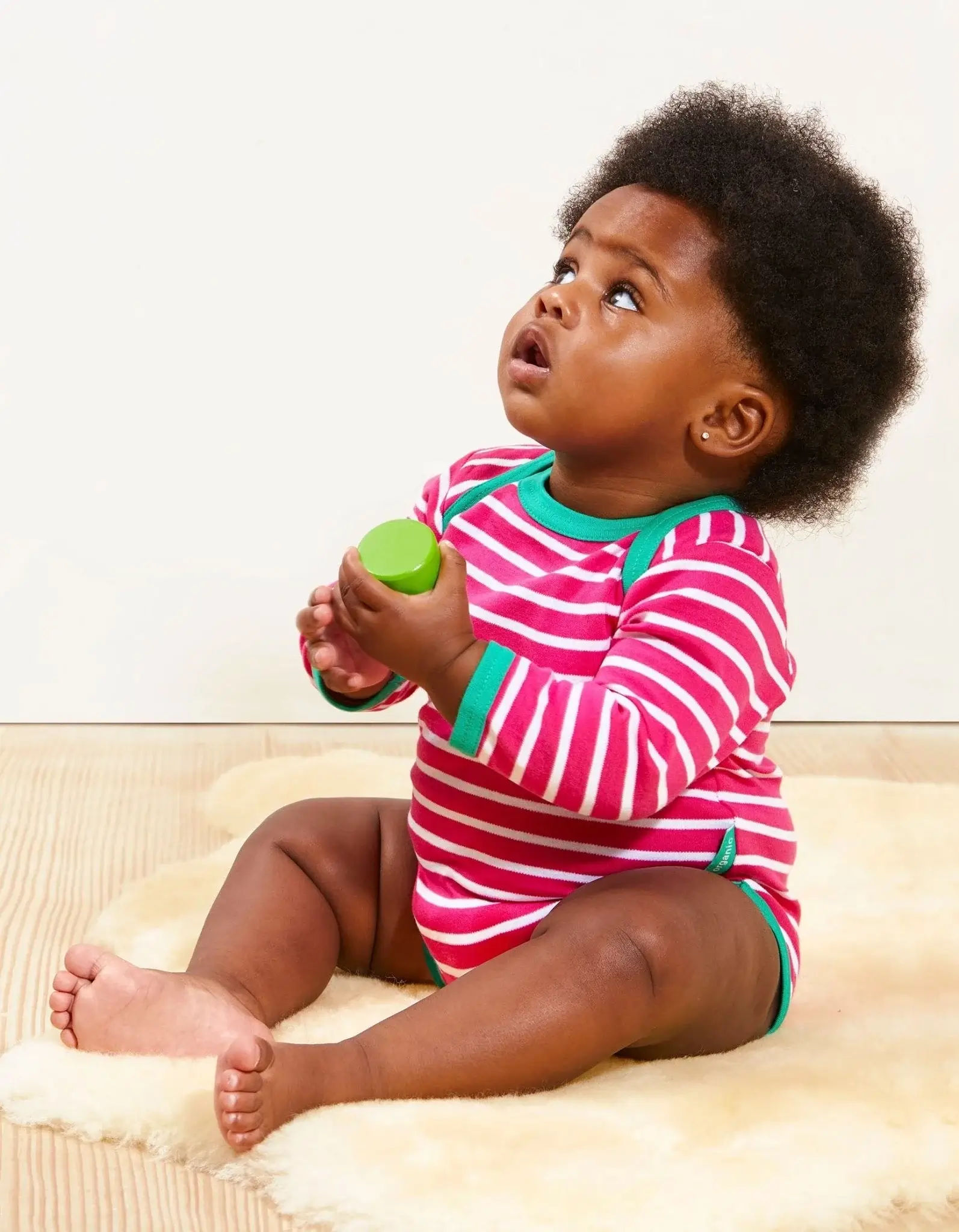 boy wearing organic cotton baby clothes by toby tiger