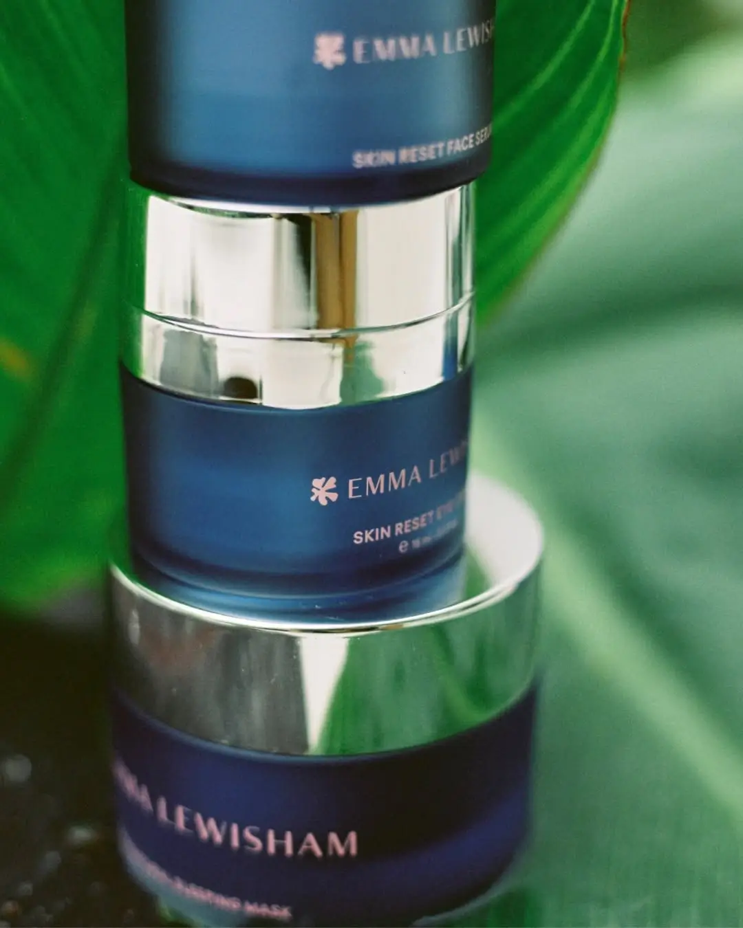 Stack of Emma Lewsham Refillable Skincare Containers