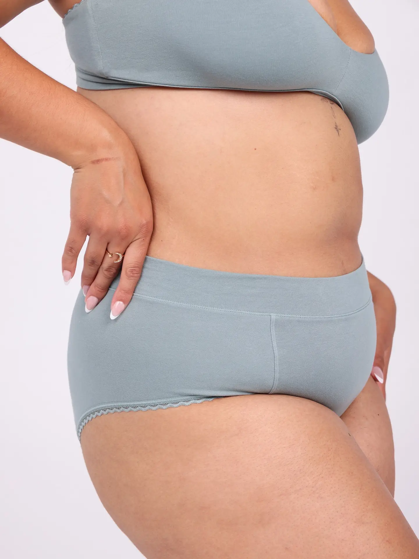 woman wearing blue organic cotton underwear & bra from La Coochie