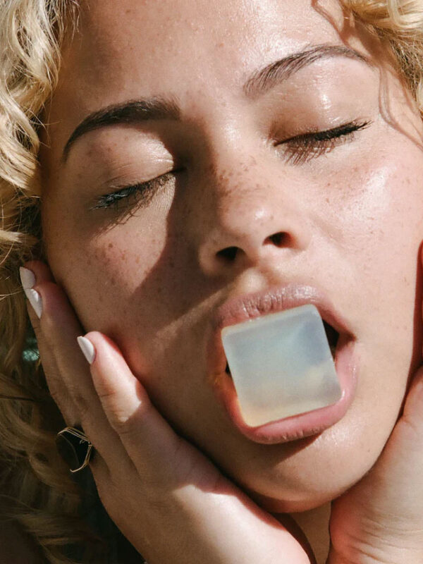 women holding dew mighty refillable serums