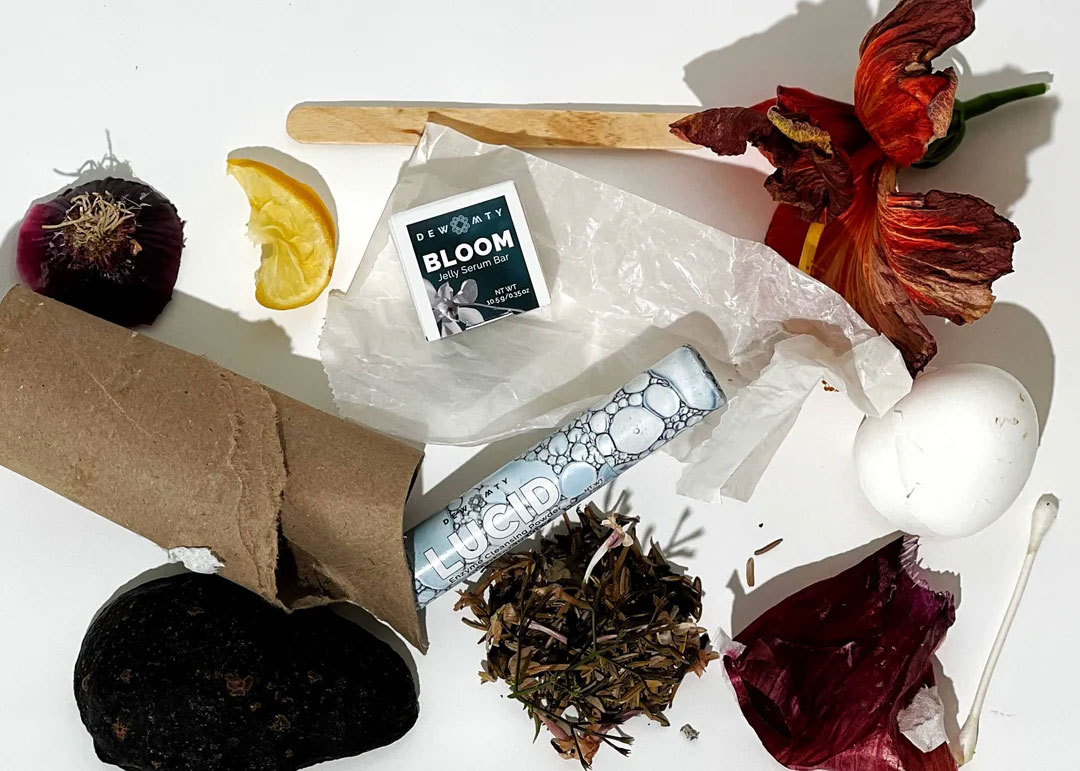 flatlay of dew mighty refillable plastic free skincare products