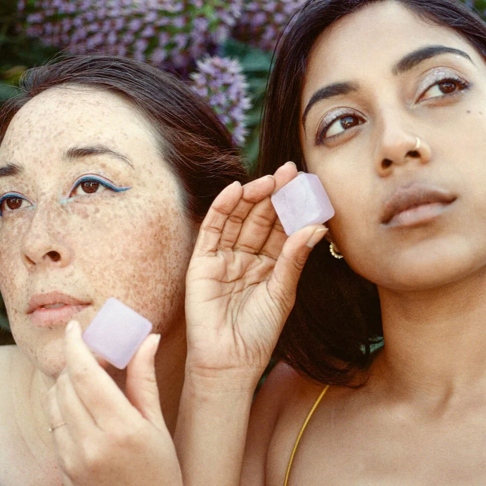 women holding dew mighty refillable serums