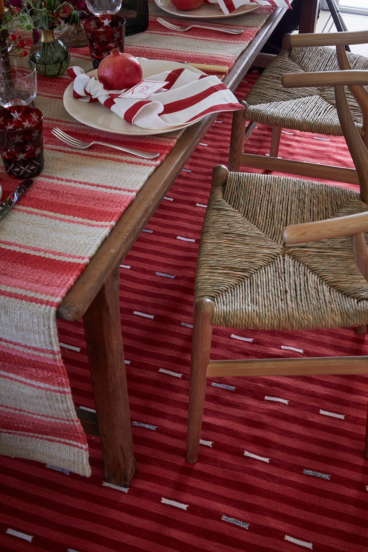 Red table linens and rugs from Weaver Green